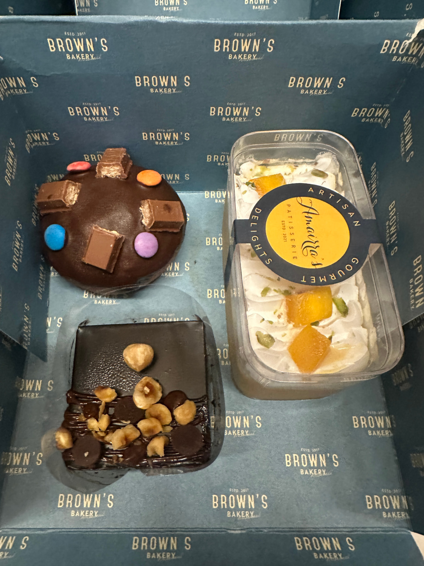 Chocolate candy cake, hazelnut brownie and an Amairra's mango custard tub